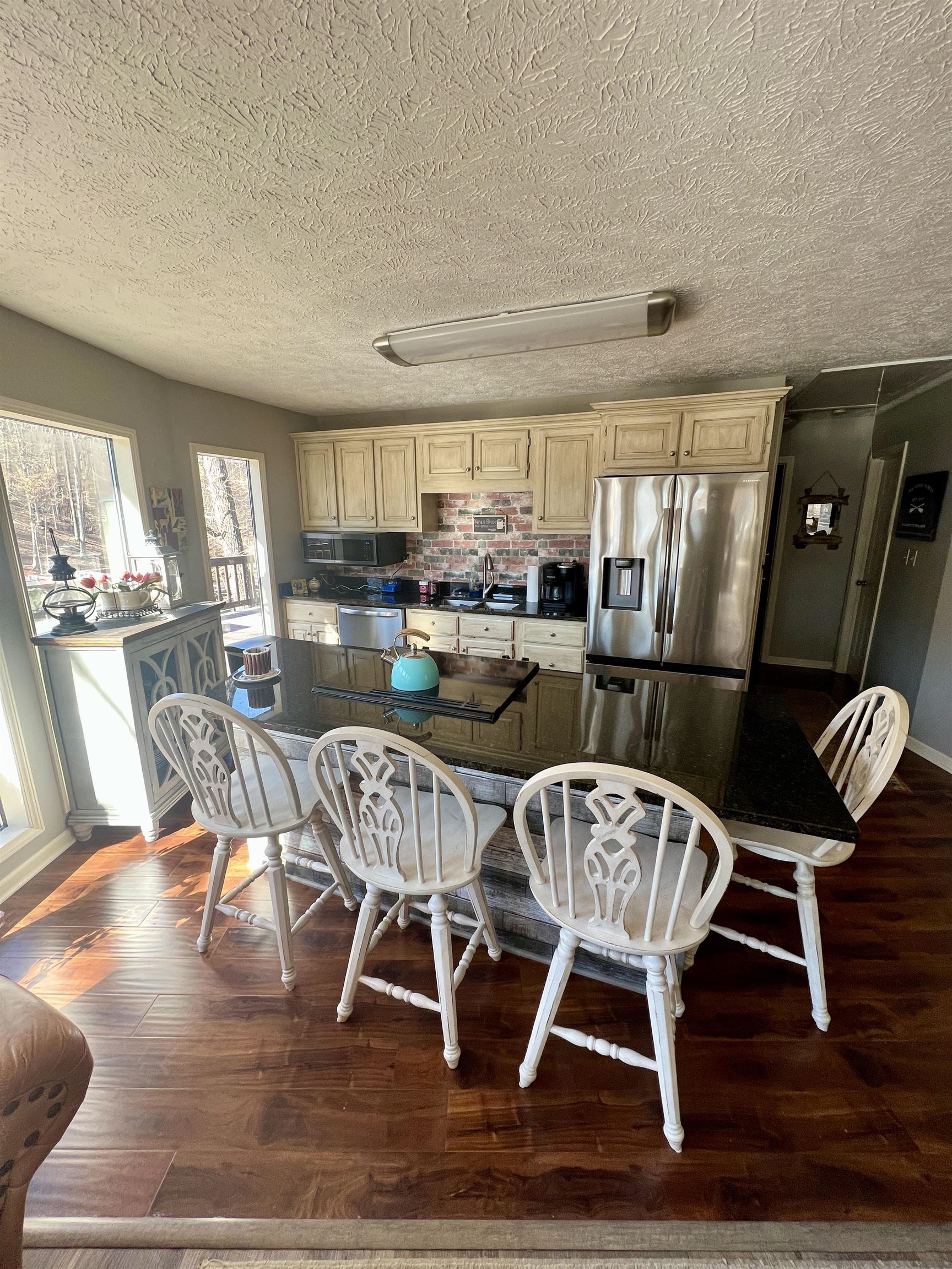 60 Point Grand Bluff Savannah, TN 38372 - Photo 12 of 34 a view of a dining room with furniture window and wooden floor
