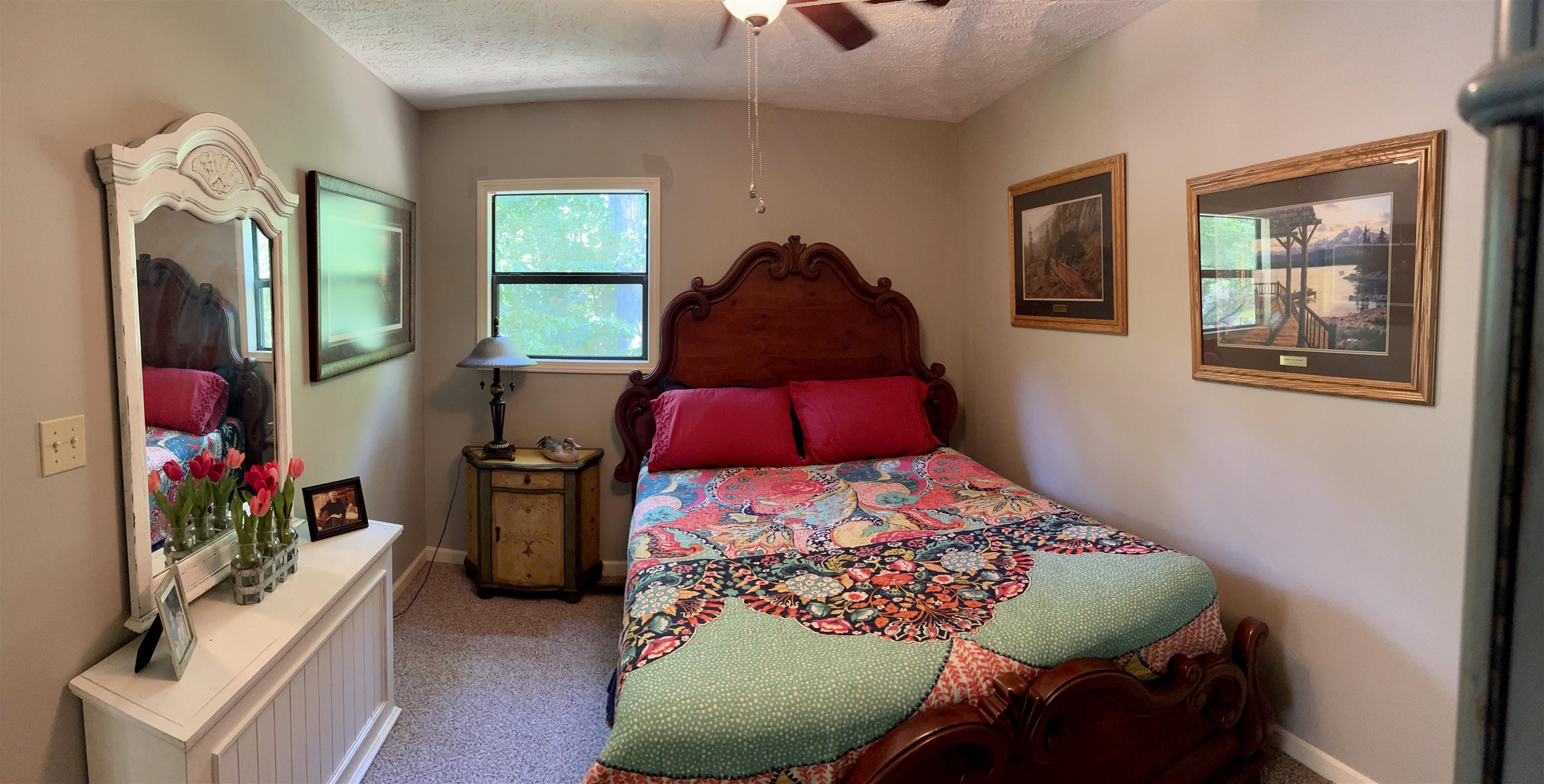 60 Point Grand Bluff Savannah, TN 38372 - Photo 18 of 34 a bedroom with a bed and a painting on the wall