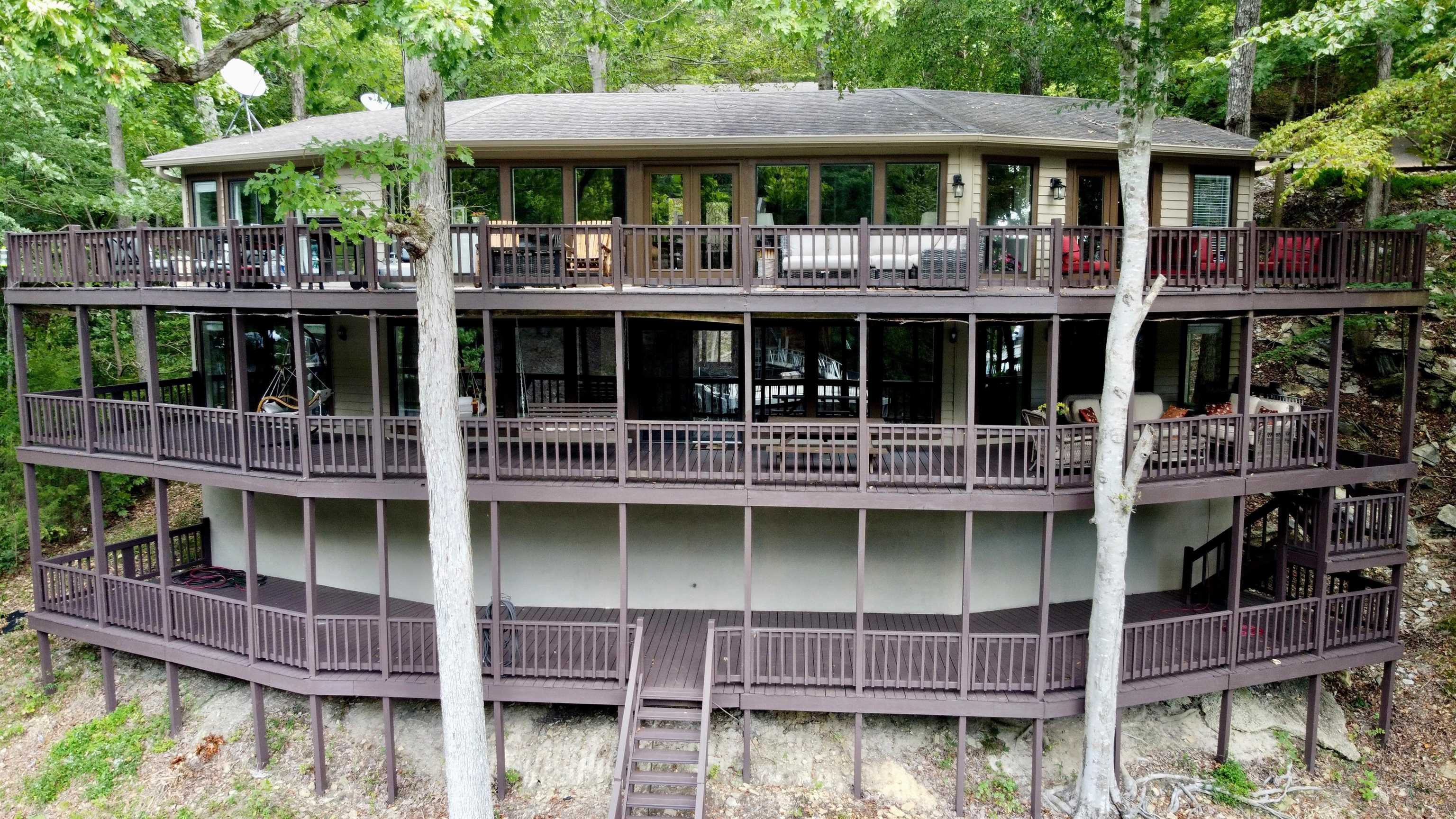 60 Point Grand Bluff Savannah, TN 38372 - Photo 3 of 34 a view of a barbeque with a table and chairs under an umbrella