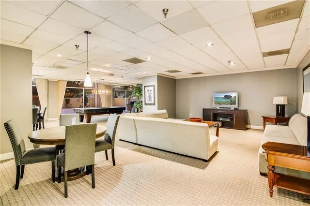 a living room with furniture and a table