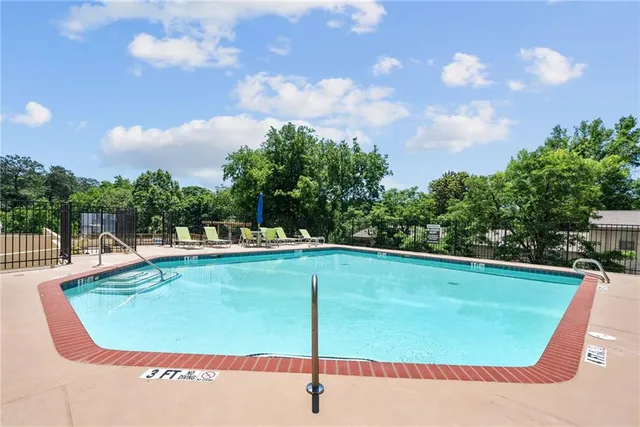 a view of swimming pool from a balcony