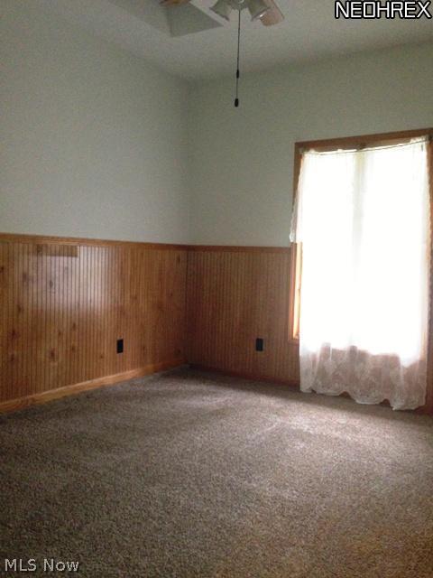9809 Johnnycake Ridge Road Mentor, OH 44060 - Photo 6 of 18 The family room-den could be used as a fourth bedroom. Newer carpet, fresh paint and wainscoting makes this room warm and cozy.