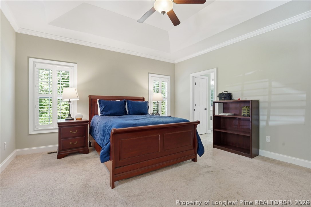 16 Ridge Road Jackson Springs, NC 27281 - Photo 26 of 50 a bedroom with a bed and a chandelier