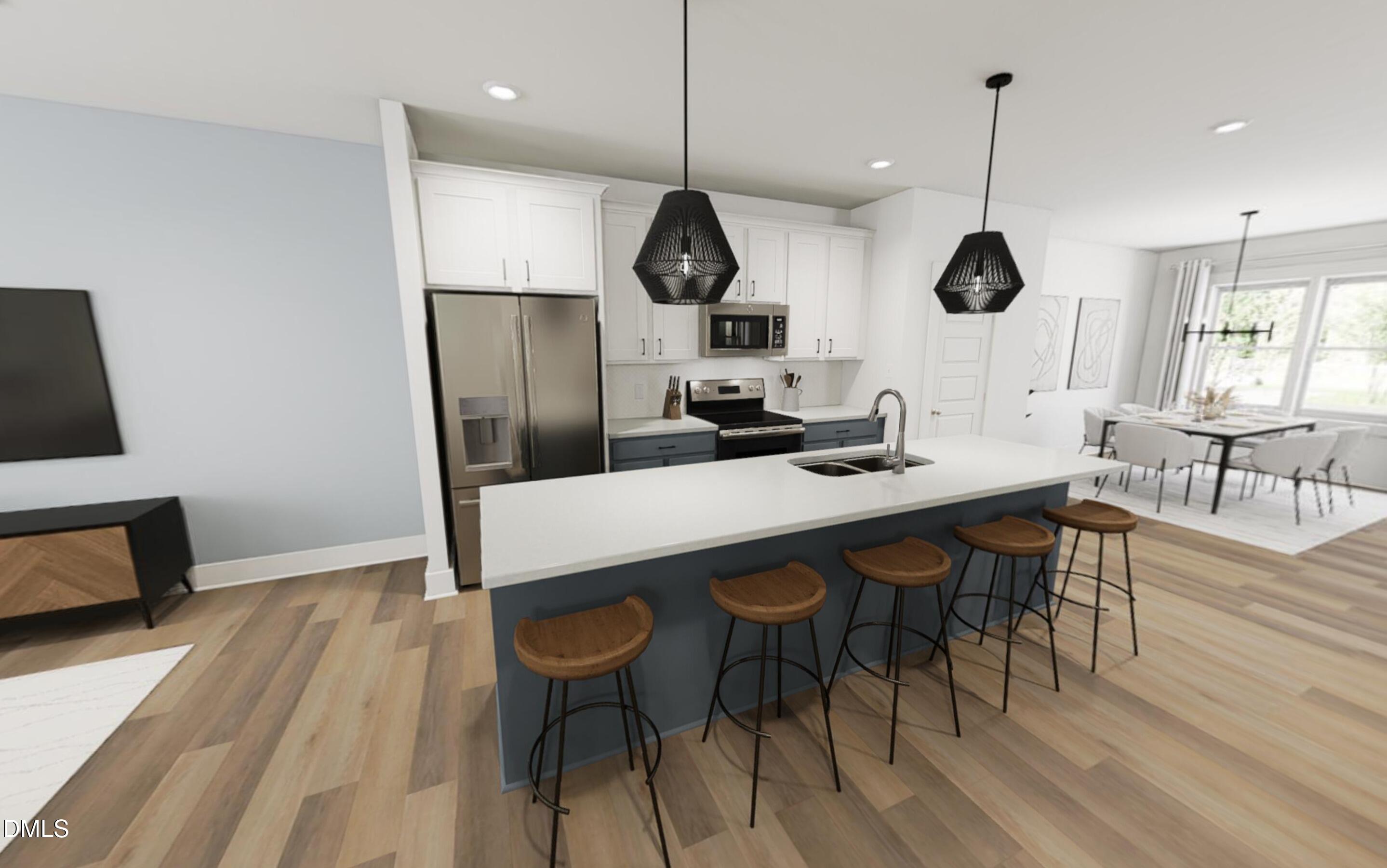 871 Central Park Drive Raleigh, NC 27604 - Photo 2 of 22 a kitchen with a dining table chairs and white cabinets