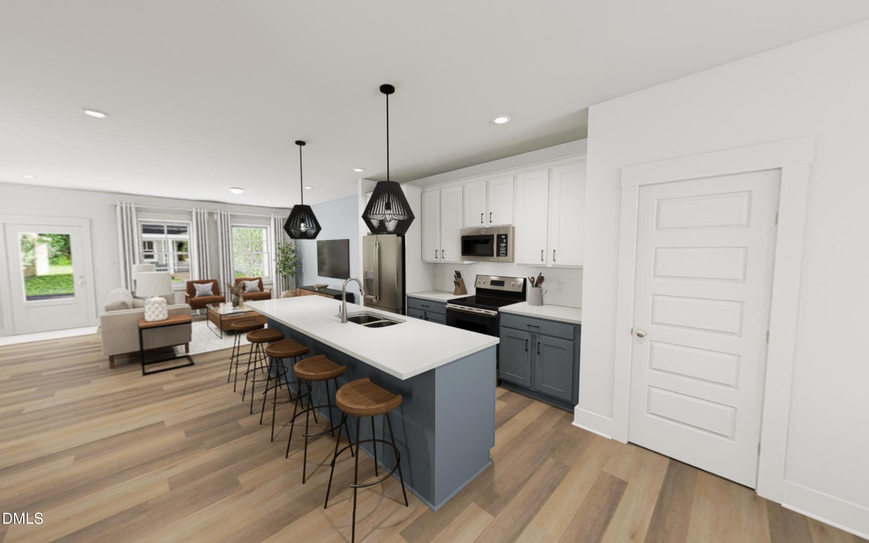 871 Central Park Drive Raleigh, NC 27604 - Photo 5 of 22 a open kitchen with white cabinets and stainless steel appliances