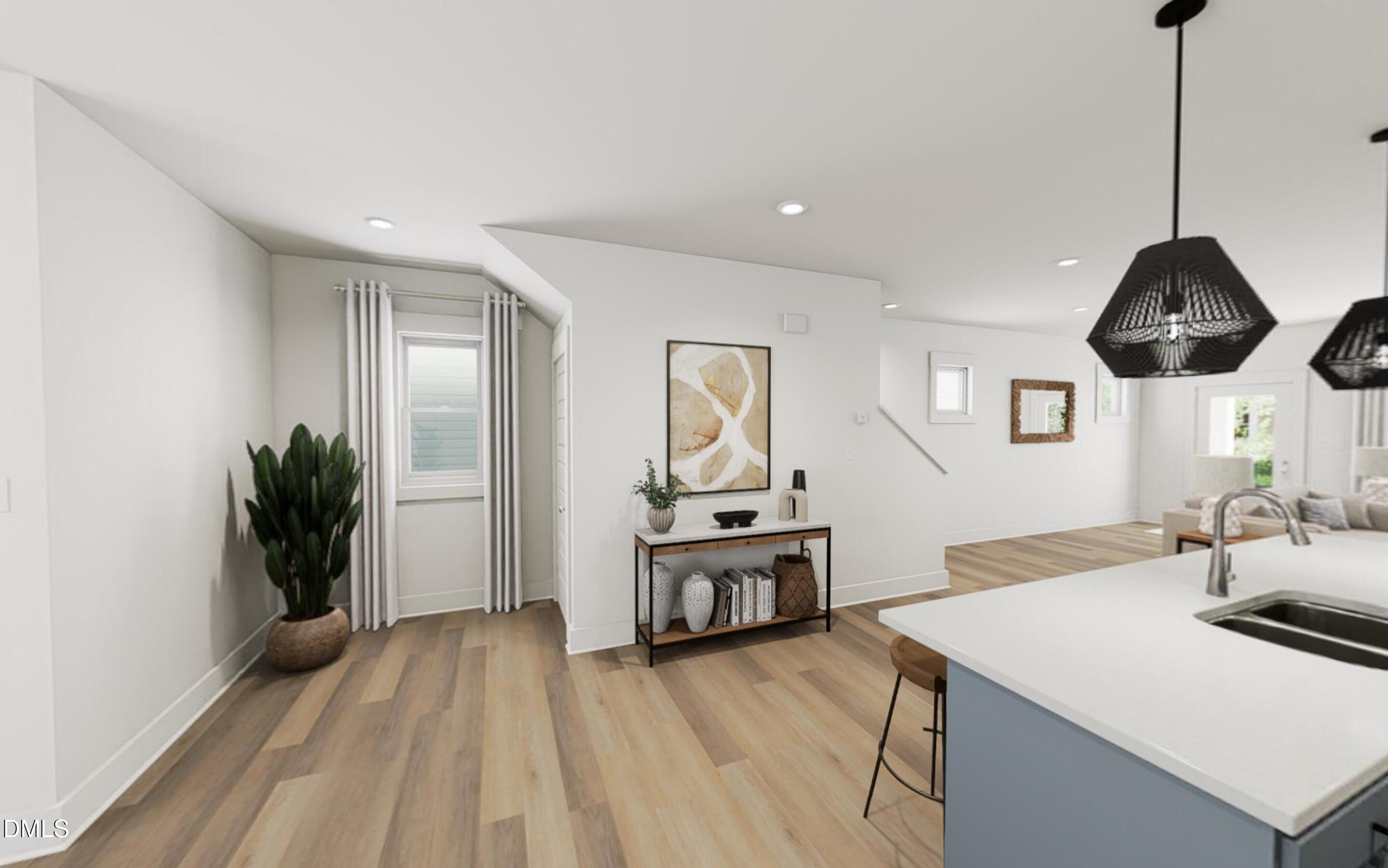 871 Central Park Drive Raleigh, NC 27604 - Photo 6 of 22 a kitchen with a sink a counter space and wooden floor