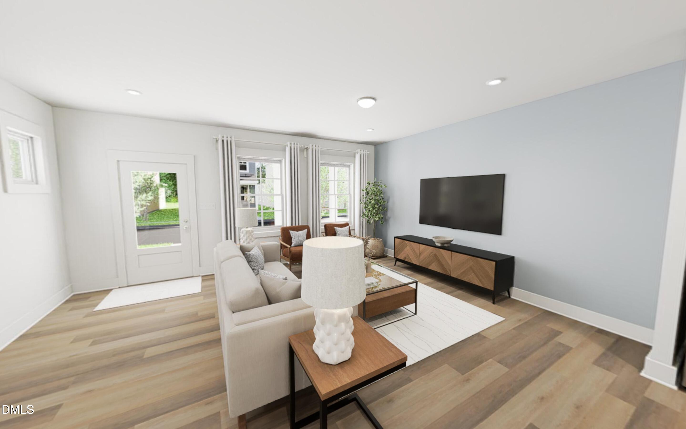 871 Central Park Drive Raleigh, NC 27604 - Photo 7 of 22 a living room with furniture and a flat screen tv