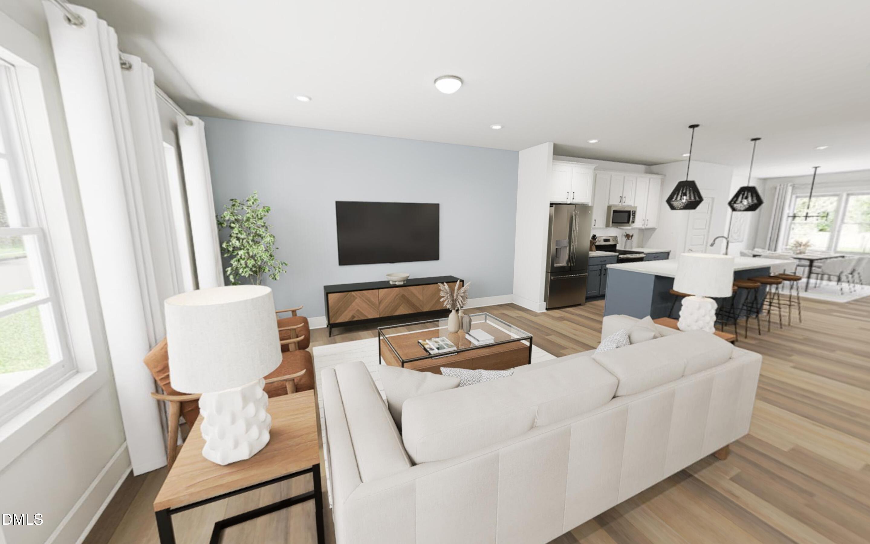 871 Central Park Drive Raleigh, NC 27604 - Photo 22 of 22 a living room with furniture a flat screen tv and white walls