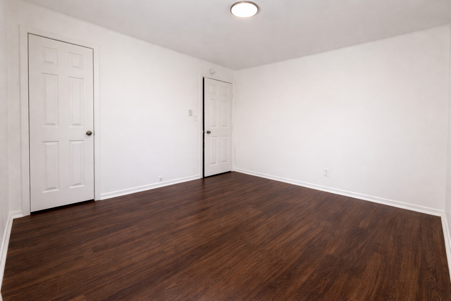 209 West Alfred Street El Campo, TX 77437 - Photo 10 of 15 a view of an empty room with wooden floor