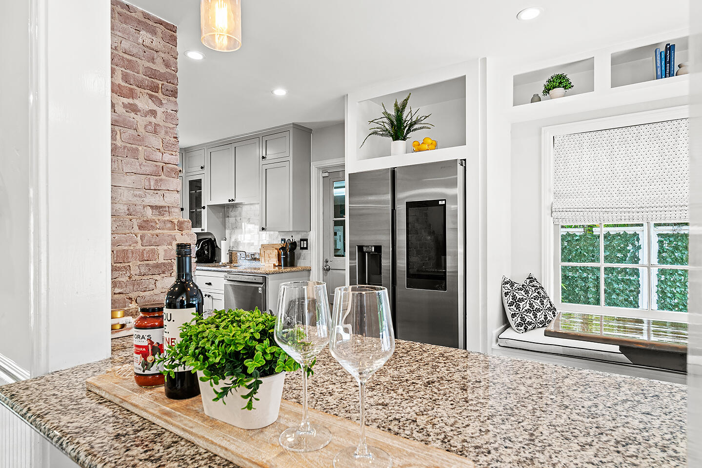 4206 Washington Road West Palm Beach, FL 33405 - Photo 13 of 50 a kitchen with stainless steel appliances kitchen island granite countertop a refrigerator and a stove top oven