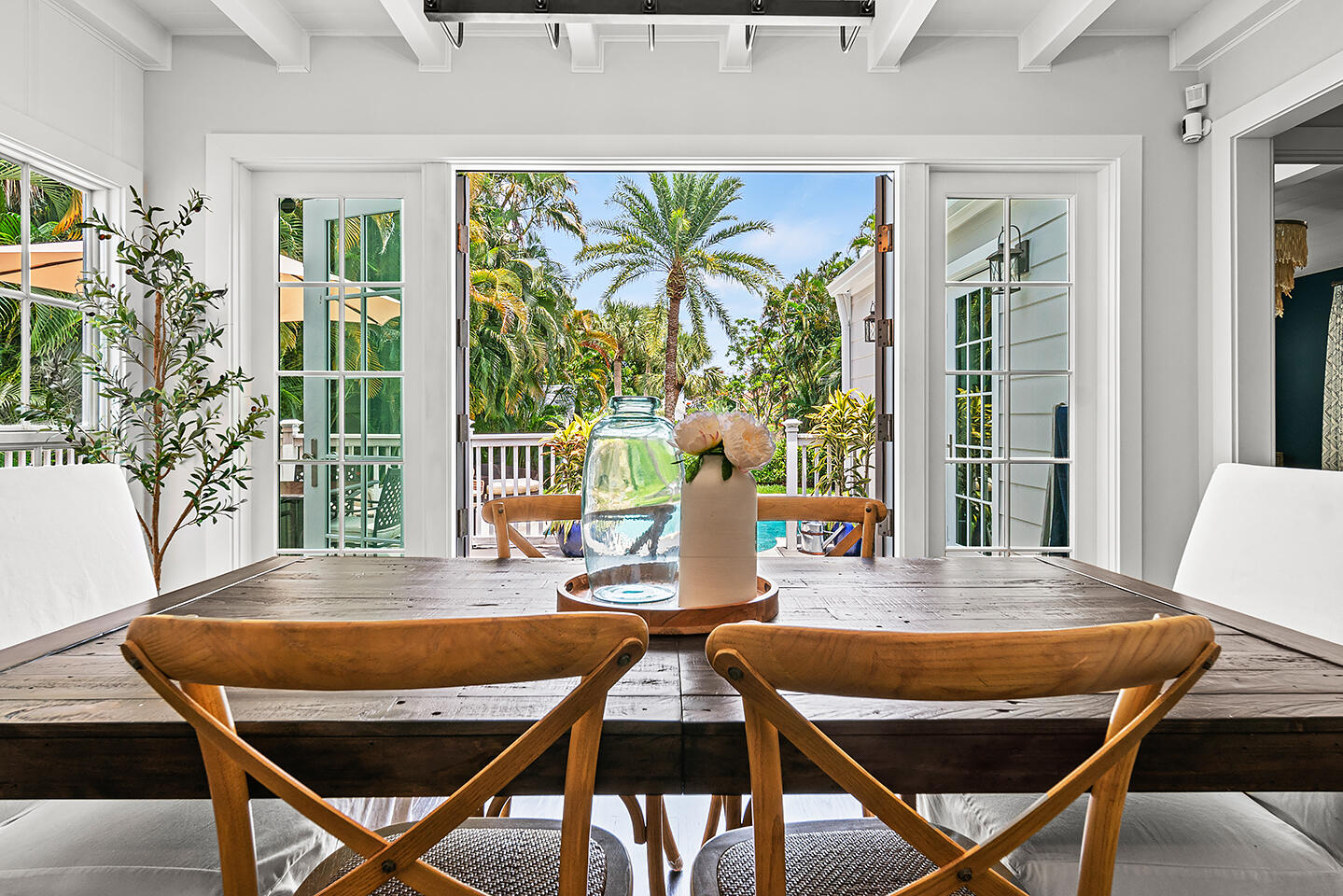 4206 Washington Road West Palm Beach, FL 33405 - Photo 14 of 50 a view of a dining room with furniture wooden floor and a potted plant