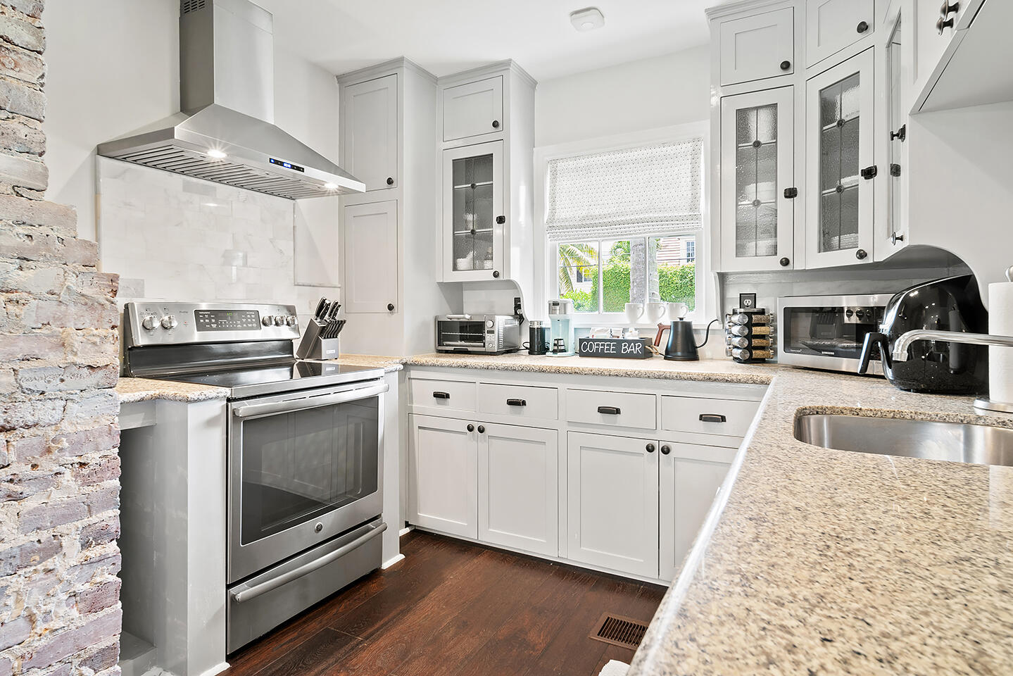 4206 Washington Road West Palm Beach, FL 33405 - Photo 16 of 50 a kitchen with granite countertop a sink stove and cabinets