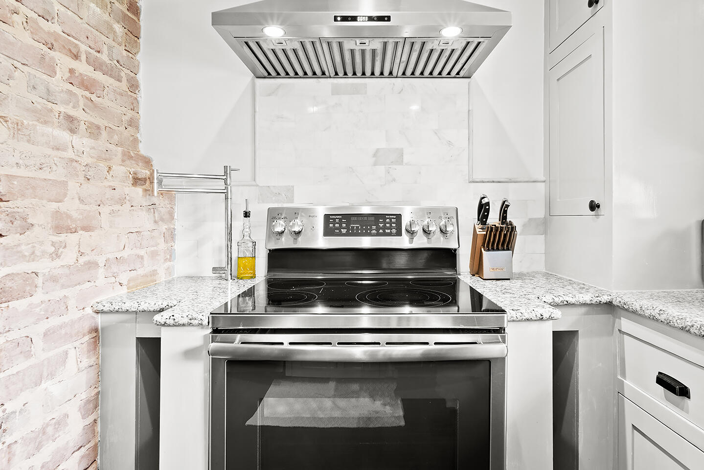 4206 Washington Road West Palm Beach, FL 33405 - Photo 19 of 50 a stove top oven sitting inside of a kitchen
