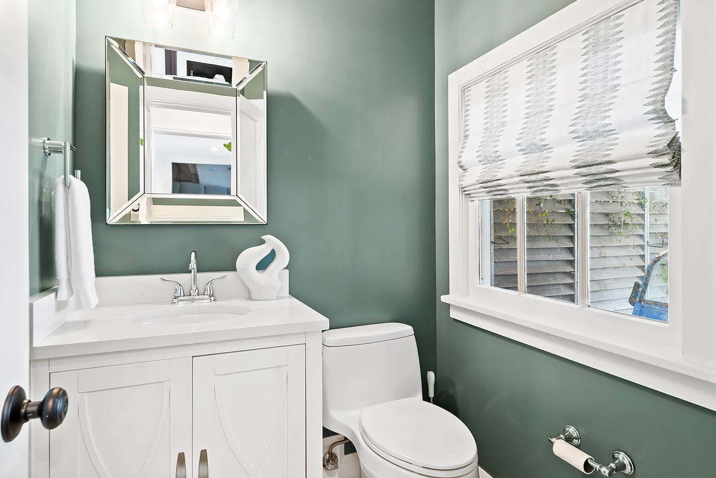 4206 Washington Road West Palm Beach, FL 33405 - Photo 32 of 50 a bathroom with a sink a toilet and a mirror
