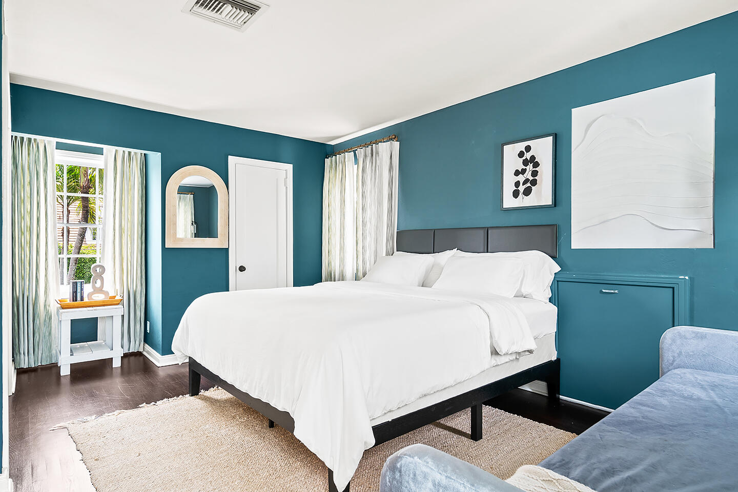 4206 Washington Road West Palm Beach, FL 33405 - Photo 33 of 50 a bedroom with a bed and a large mirror