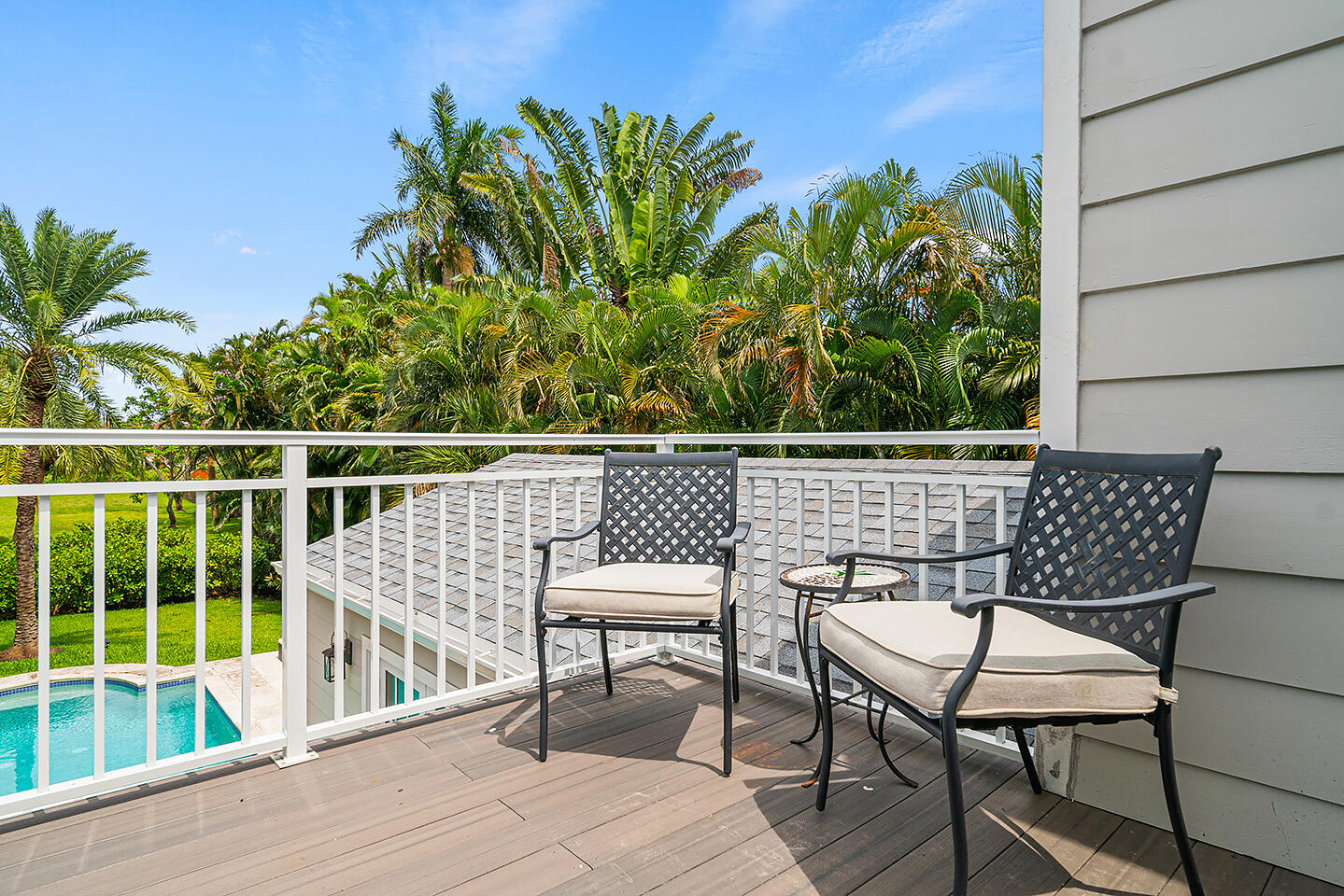 4206 Washington Road West Palm Beach, FL 33405 - Photo 36 of 50 a roof deck with table and chairs potted plants with wooden floor