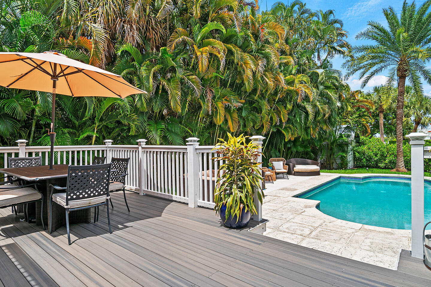 4206 Washington Road West Palm Beach, FL 33405 - Photo 40 of 50 a view of a chair and tables on the wooden floor