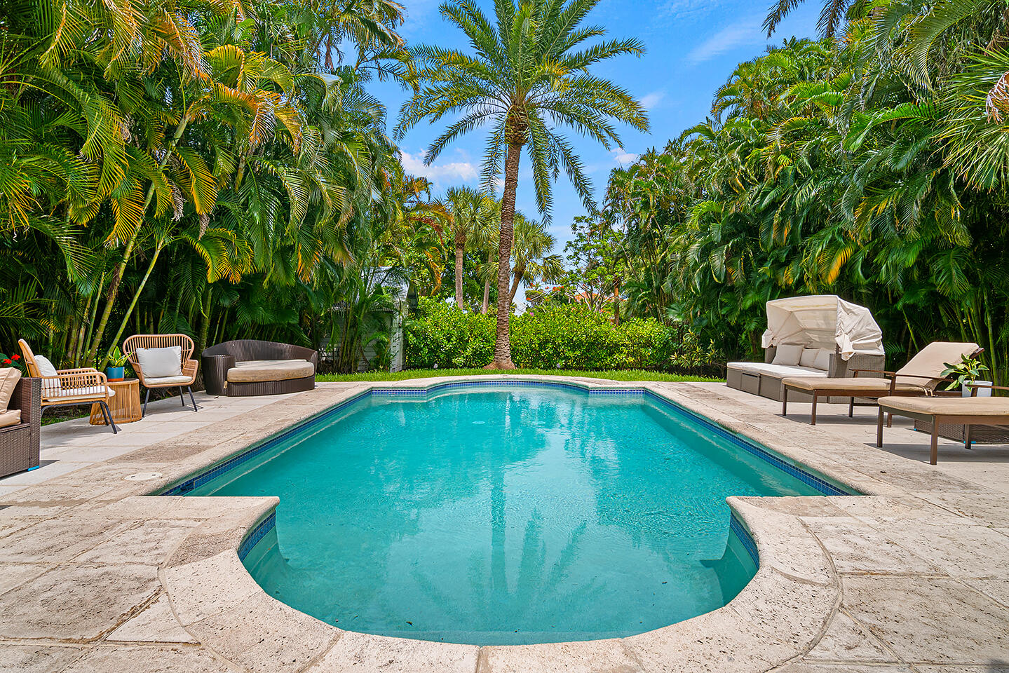 4206 Washington Road West Palm Beach, FL 33405 - Photo 41 of 50 a swimming pool with outdoor seating