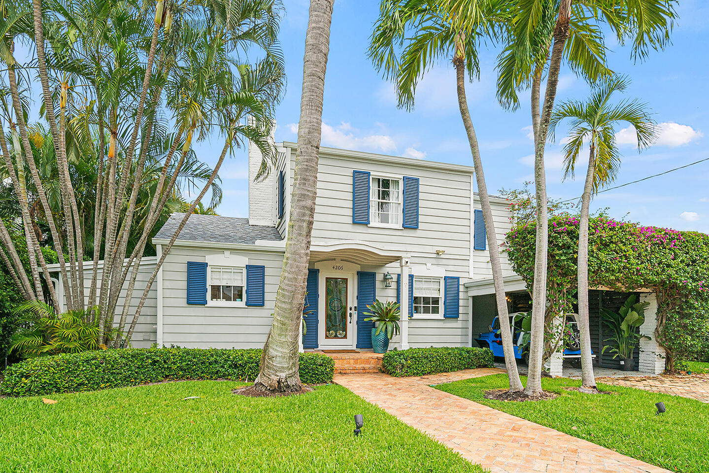 4206 Washington Road West Palm Beach, FL 33405 - Photo 49 of 50 front view of a house with a yard and palm trees