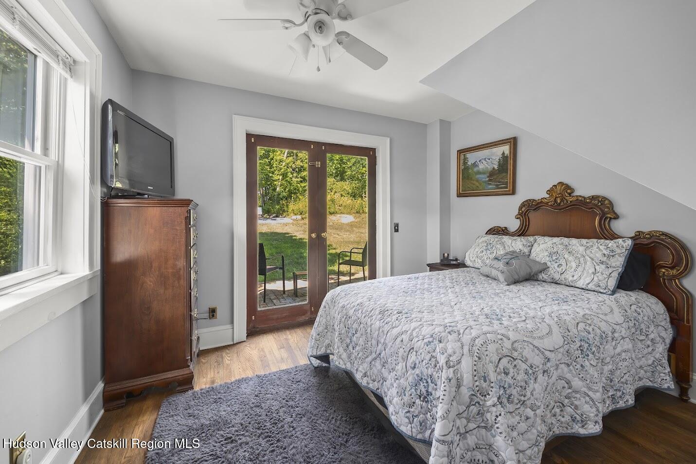 4 Greely Road Craryville, NY 12521 - Photo 14 of 37 a bed sitting in a bedroom next to a window