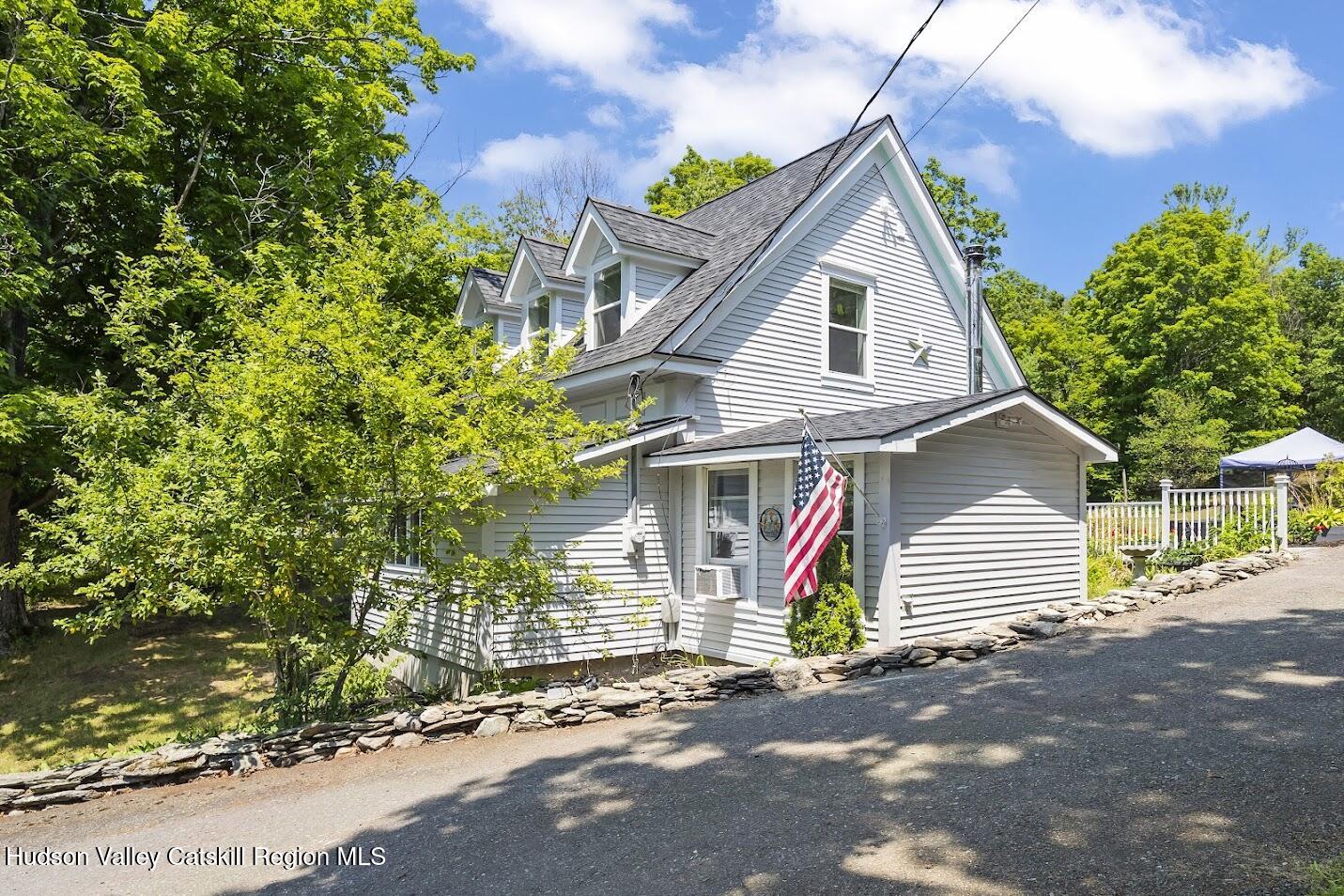 4 Greely Road Craryville, NY 12521 - Photo 20 of 37 a front view of a house with a yard and garage