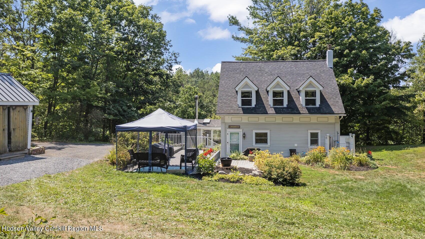 4 Greely Road Craryville, NY 12521 - Photo 21 of 37 a front view of a house with garden
