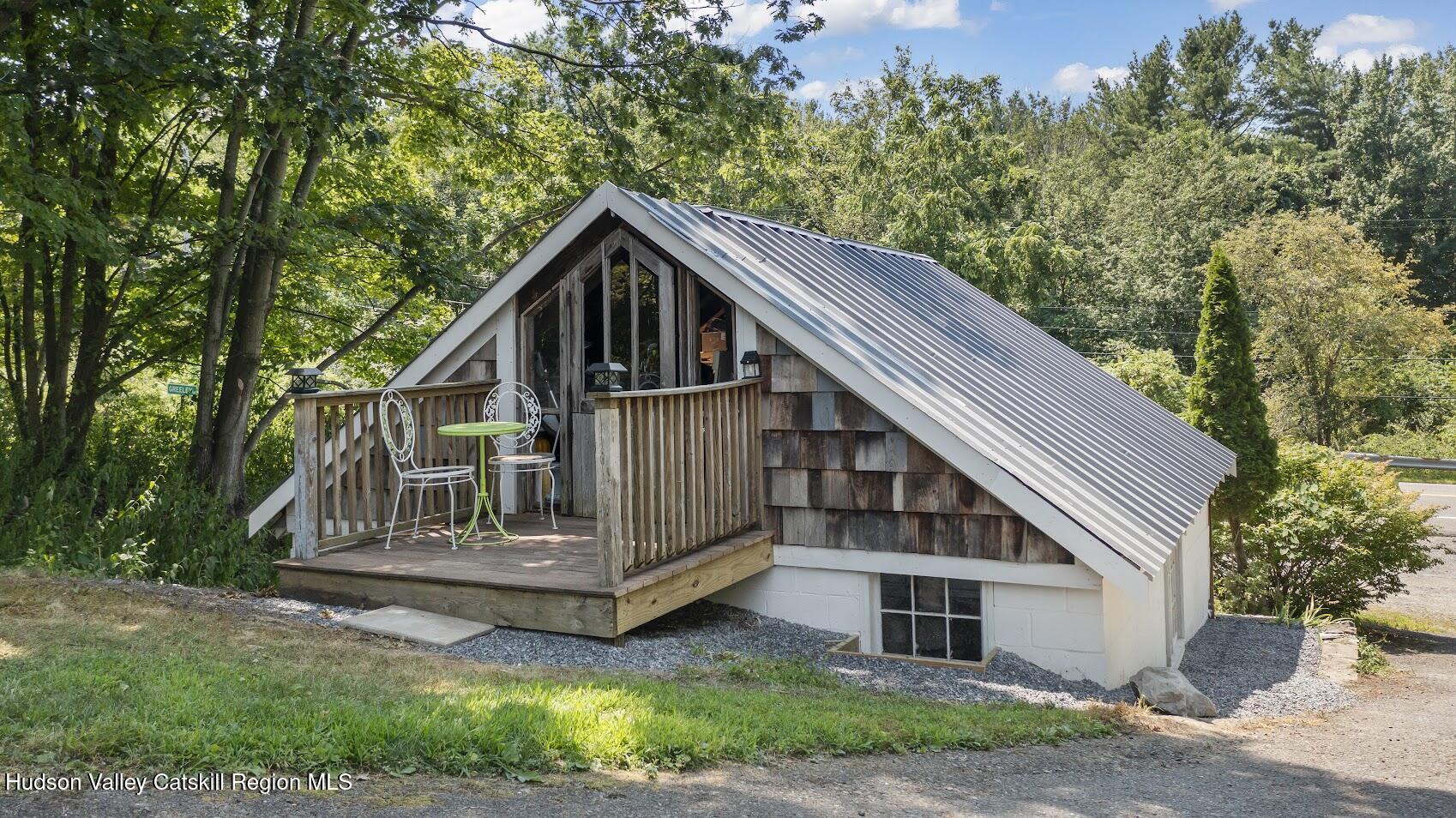 4 Greely Road Craryville, NY 12521 - Photo 27 of 37 a house that has a tree in front of it