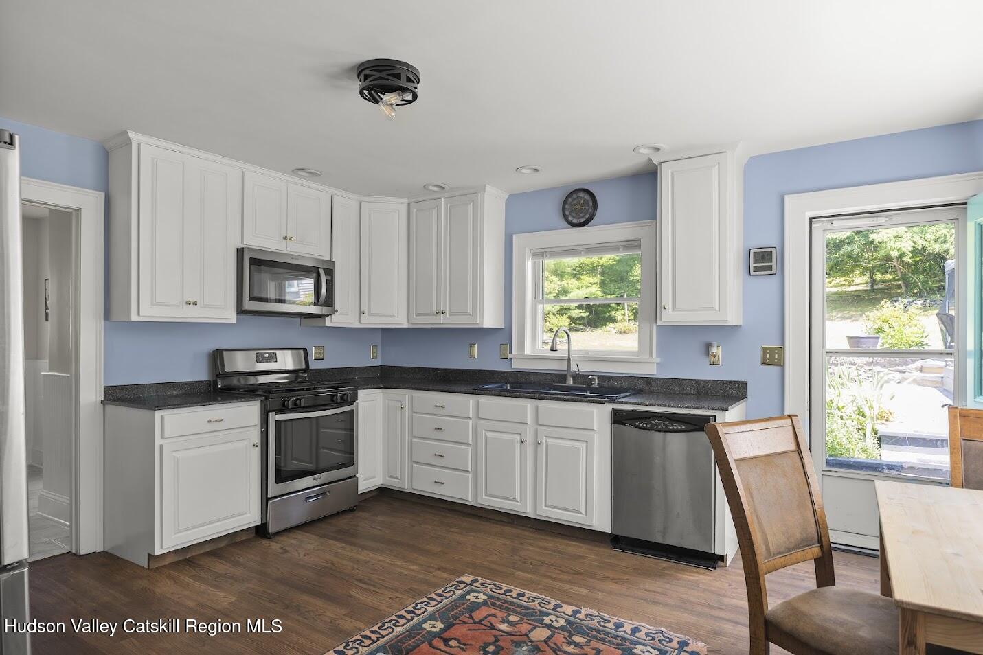 4 Greely Road Craryville, NY 12521 - Photo 6 of 37 a kitchen with granite countertop a stove sink and microwave