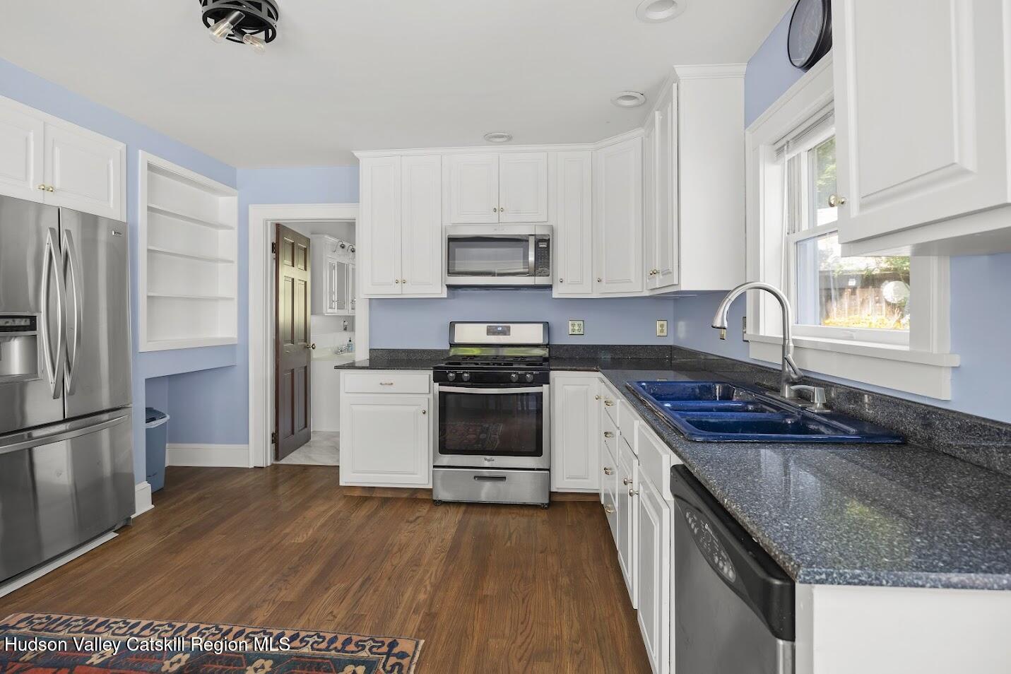 4 Greely Road Craryville, NY 12521 - Photo 8 of 37 a kitchen with granite countertop a sink stove and refrigerator