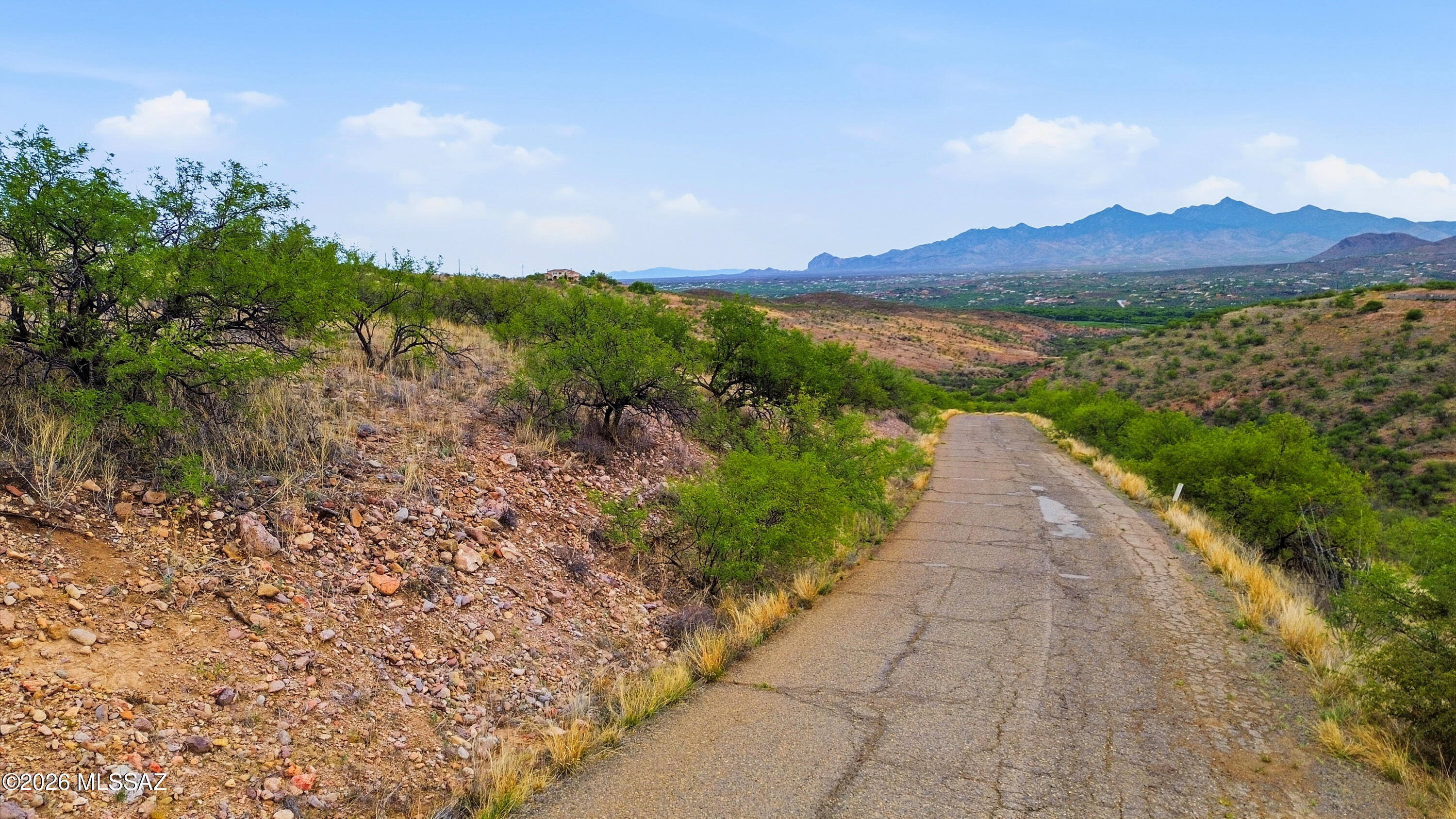 1544 Circulo Jacona, Unit 119 Rio Rico, AZ 85648 - Photo 12 of 16 a view of a pathway with a garden