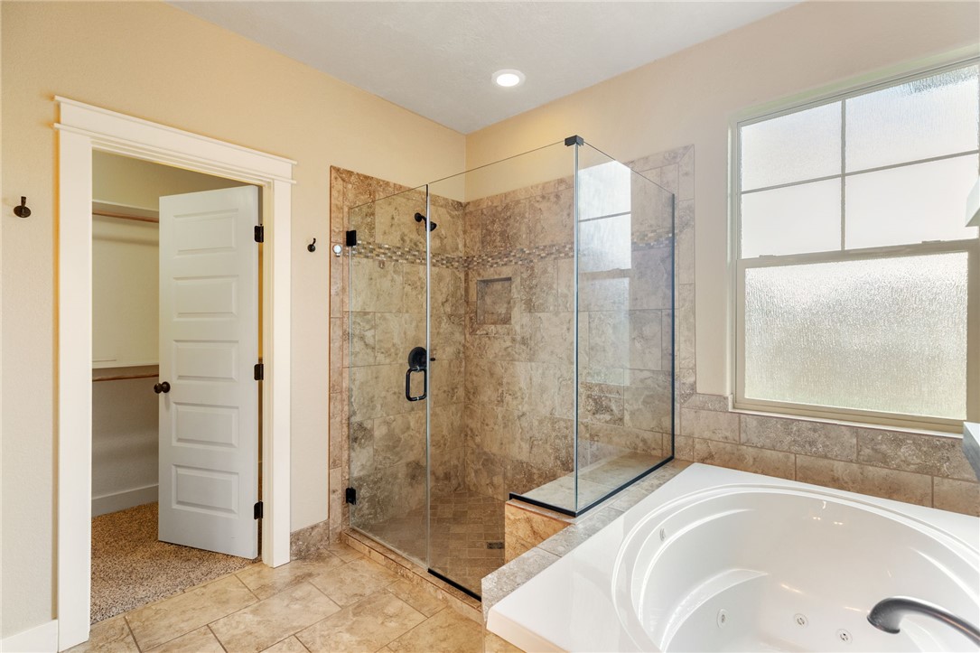 2136 Rockcliffe Loop College Station, TX 77845 - Photo 30 of 48 a bathroom with a tub sink shower and mirror