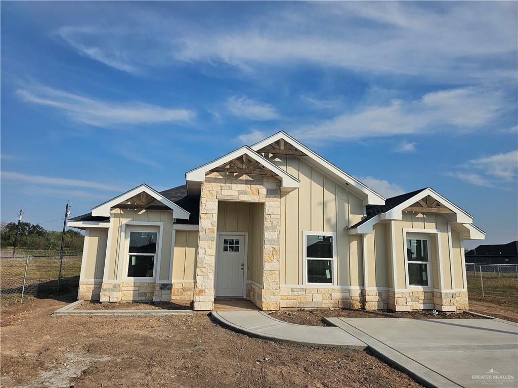 2251 Tuscany Road Weslaco, TX 78596 - Photo 2 of 4 a front view of a house with a yard