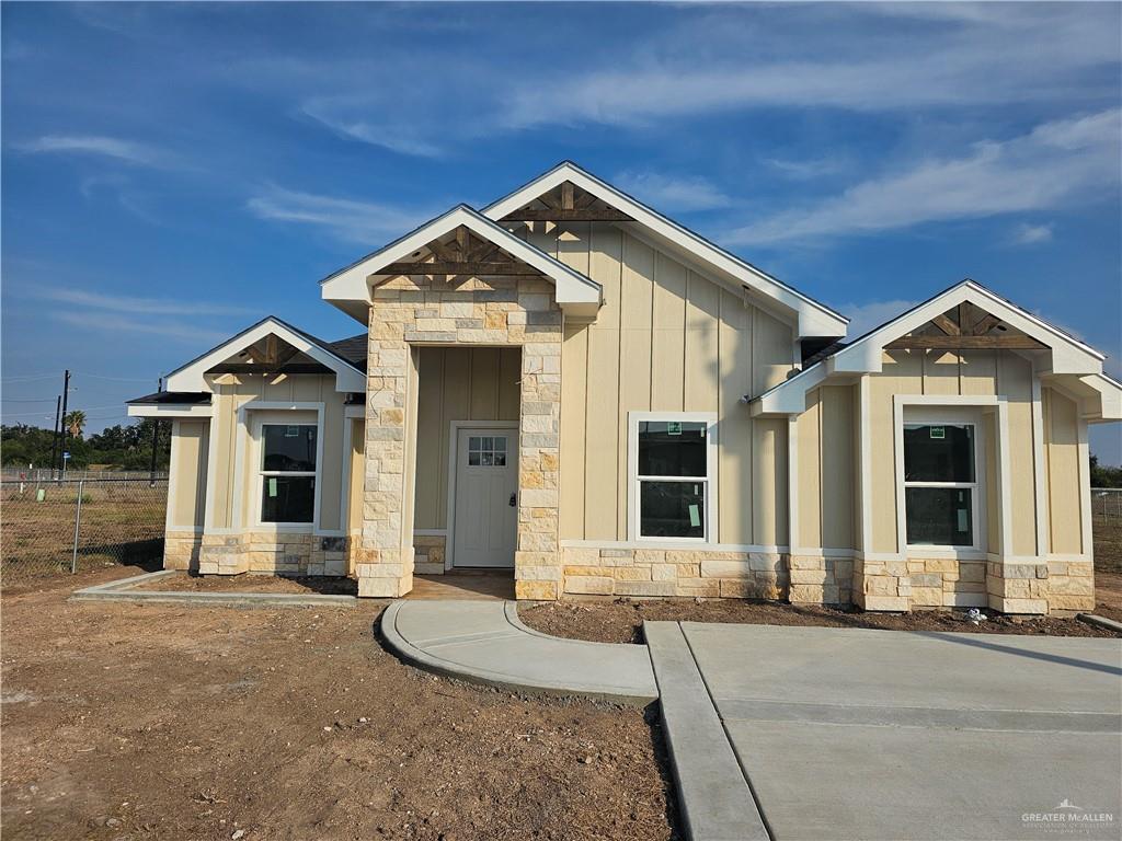 2251 Tuscany Road Weslaco, TX 78596 - Photo 4 of 4 a front view of a house with a yard