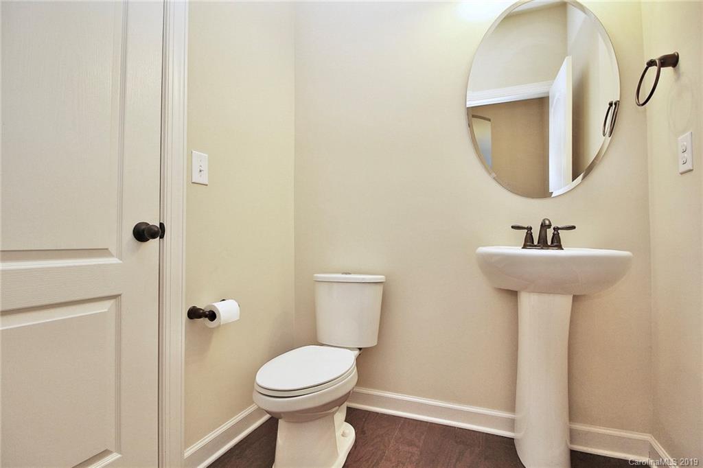 1314 Cilantro Court Tega Cay, SC 29708 - Photo 14 of 48 a bathroom with a sink toilet and a mirror