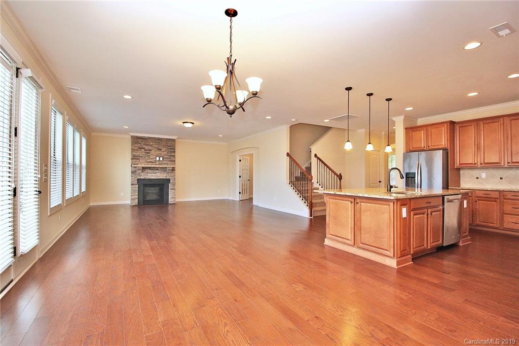 1314 Cilantro Court Tega Cay, SC 29708 - Photo 16 of 48 a view of dining room with furniture and wooden floor