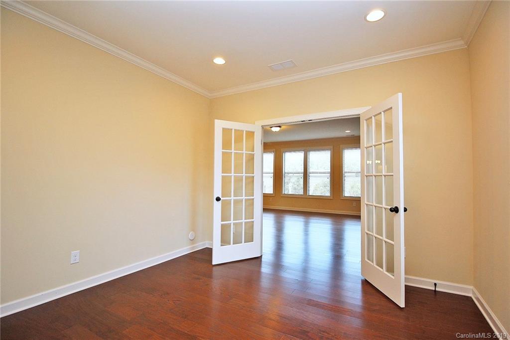 1314 Cilantro Court Tega Cay, SC 29708 - Photo 22 of 48 wooden floor in an empty room with a window