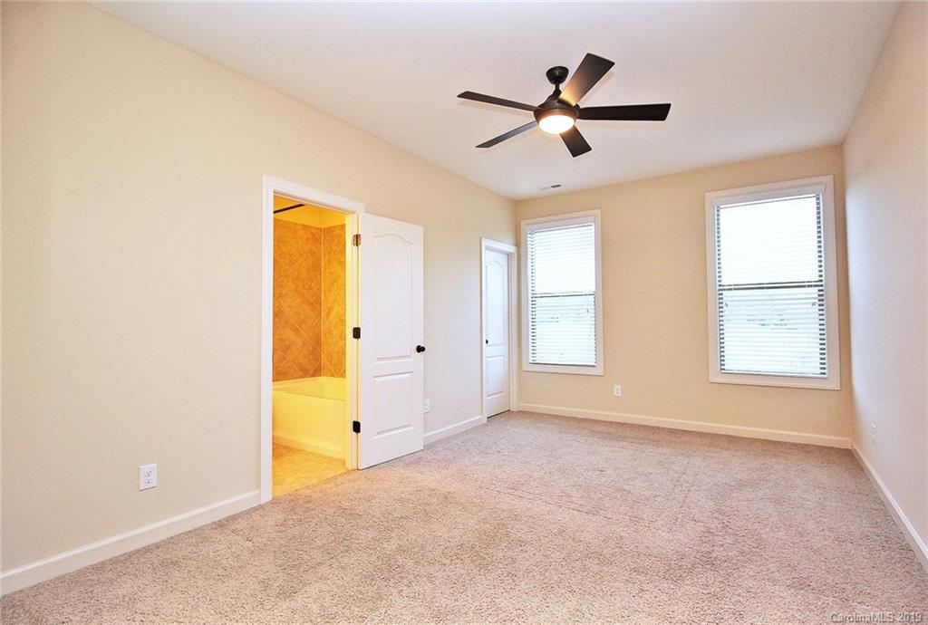 1314 Cilantro Court Tega Cay, SC 29708 - Photo 32 of 48 a view of a livingroom with a ceiling fan and window