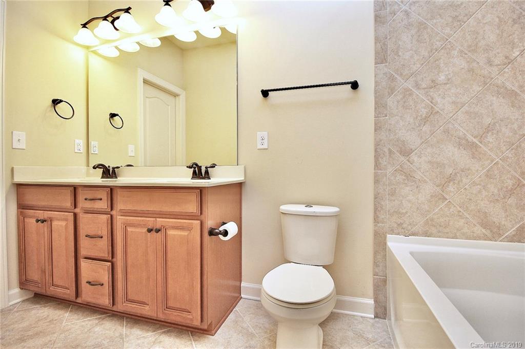 1314 Cilantro Court Tega Cay, SC 29708 - Photo 33 of 48 a bathroom with a sink and a mirror