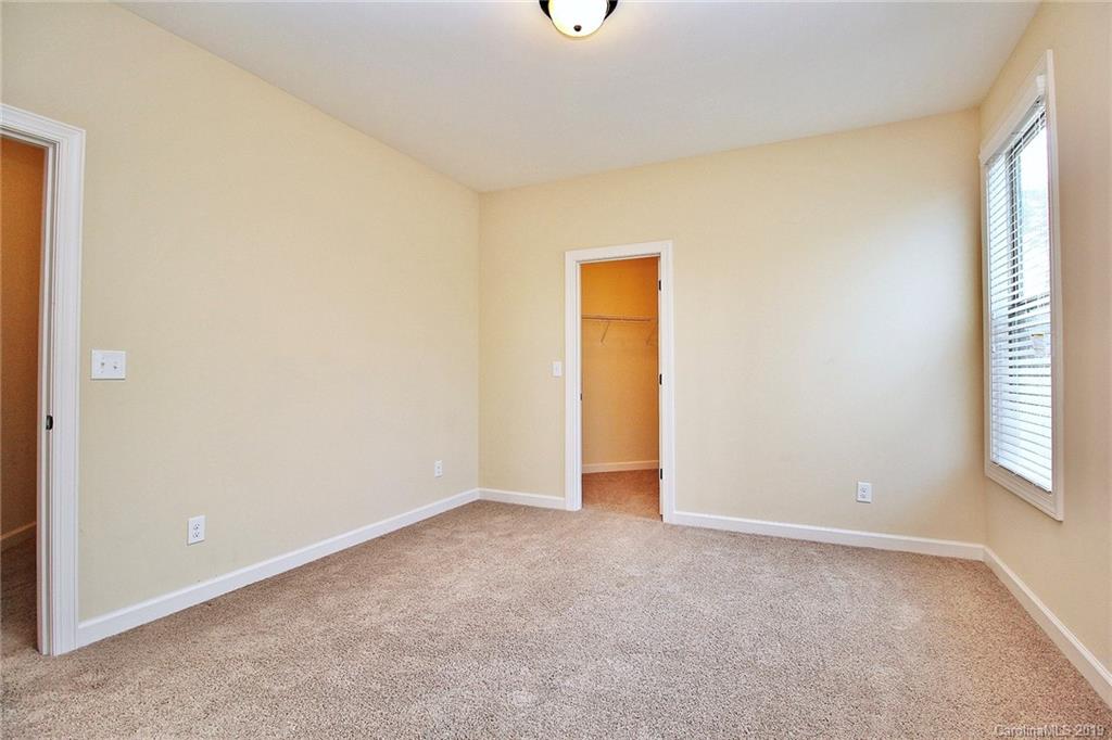 1314 Cilantro Court Tega Cay, SC 29708 - Photo 35 of 48 a view of an empty room with a window