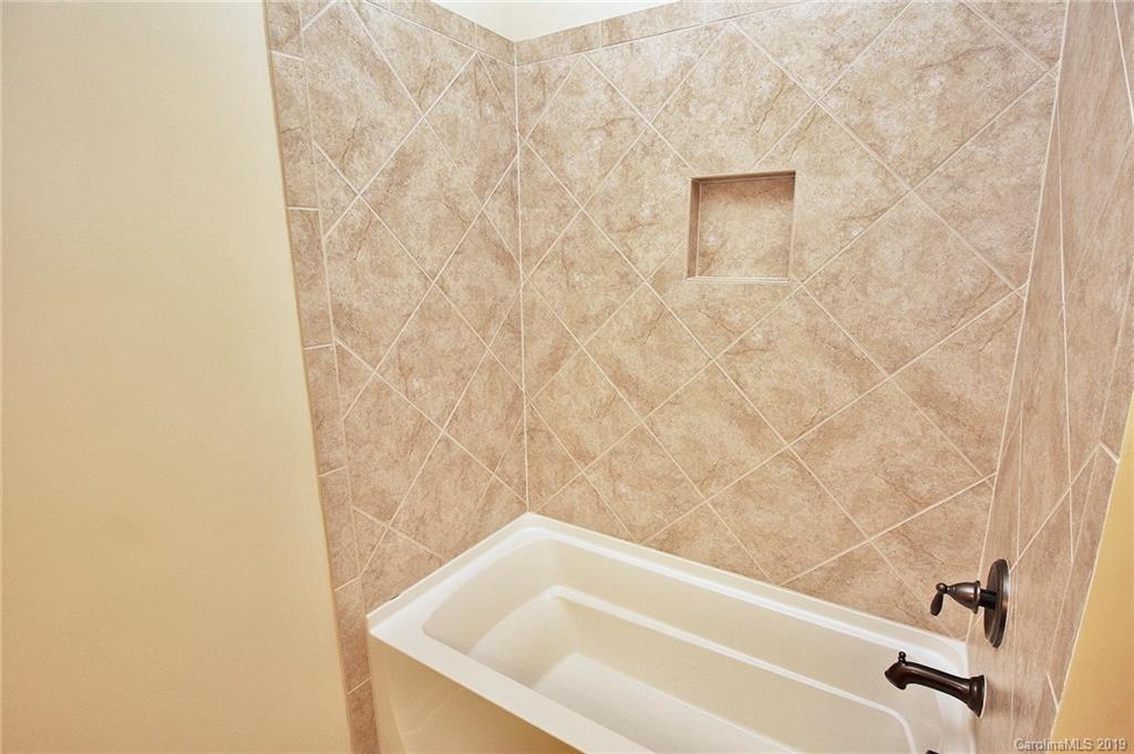 1314 Cilantro Court Tega Cay, SC 29708 - Photo 37 of 48 a bathroom with a bathtub