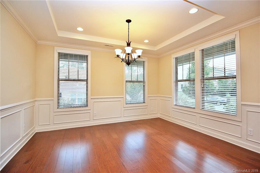 1314 Cilantro Court Tega Cay, SC 29708 - Photo 8 of 48 a view of a room with wooden floors and natural light