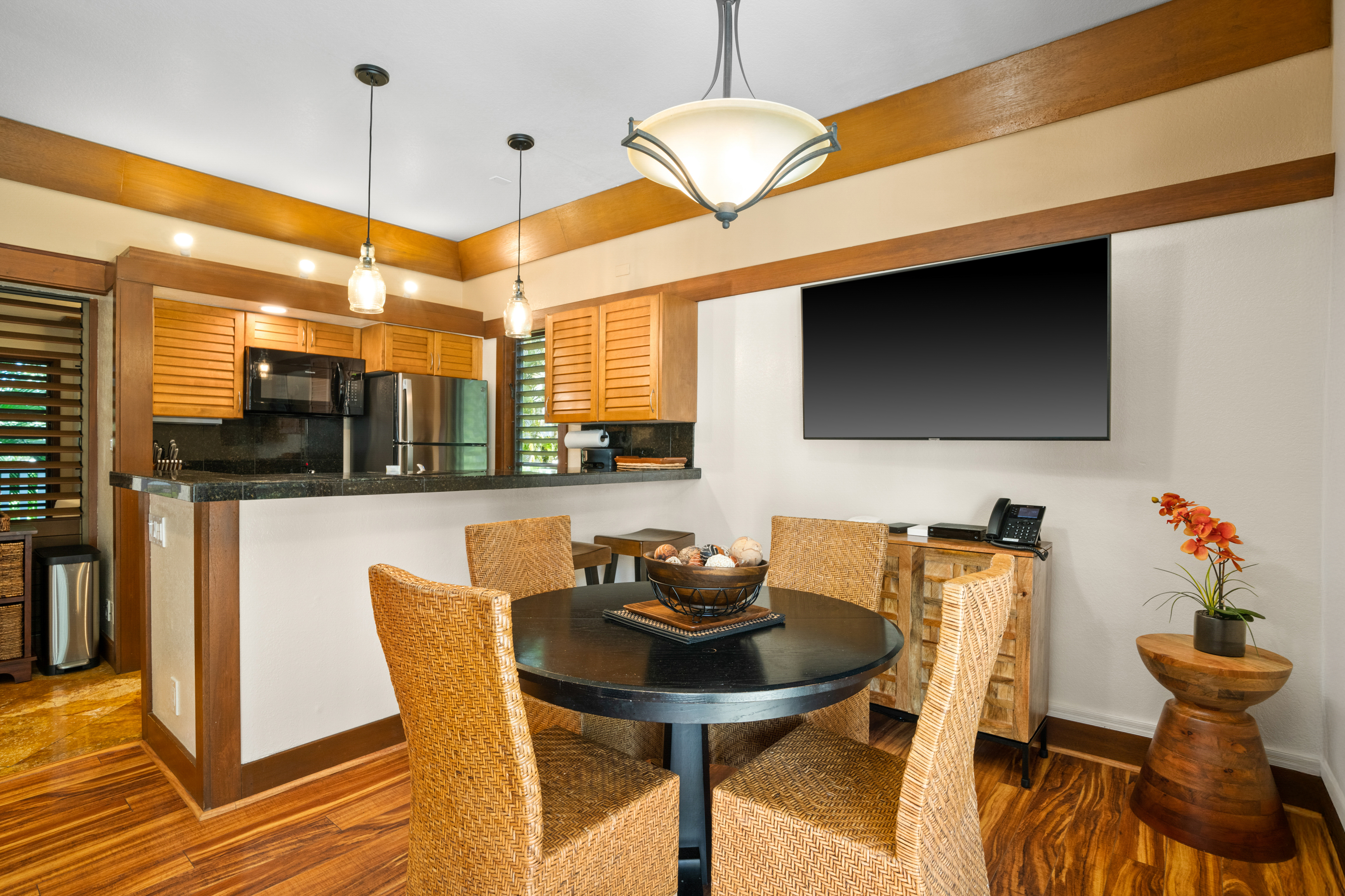 2253 Poipu Road, Unit 425 Koloa, HI 96756 - Photo 13 of 18 a view of a dining room with furniture and wooden floor