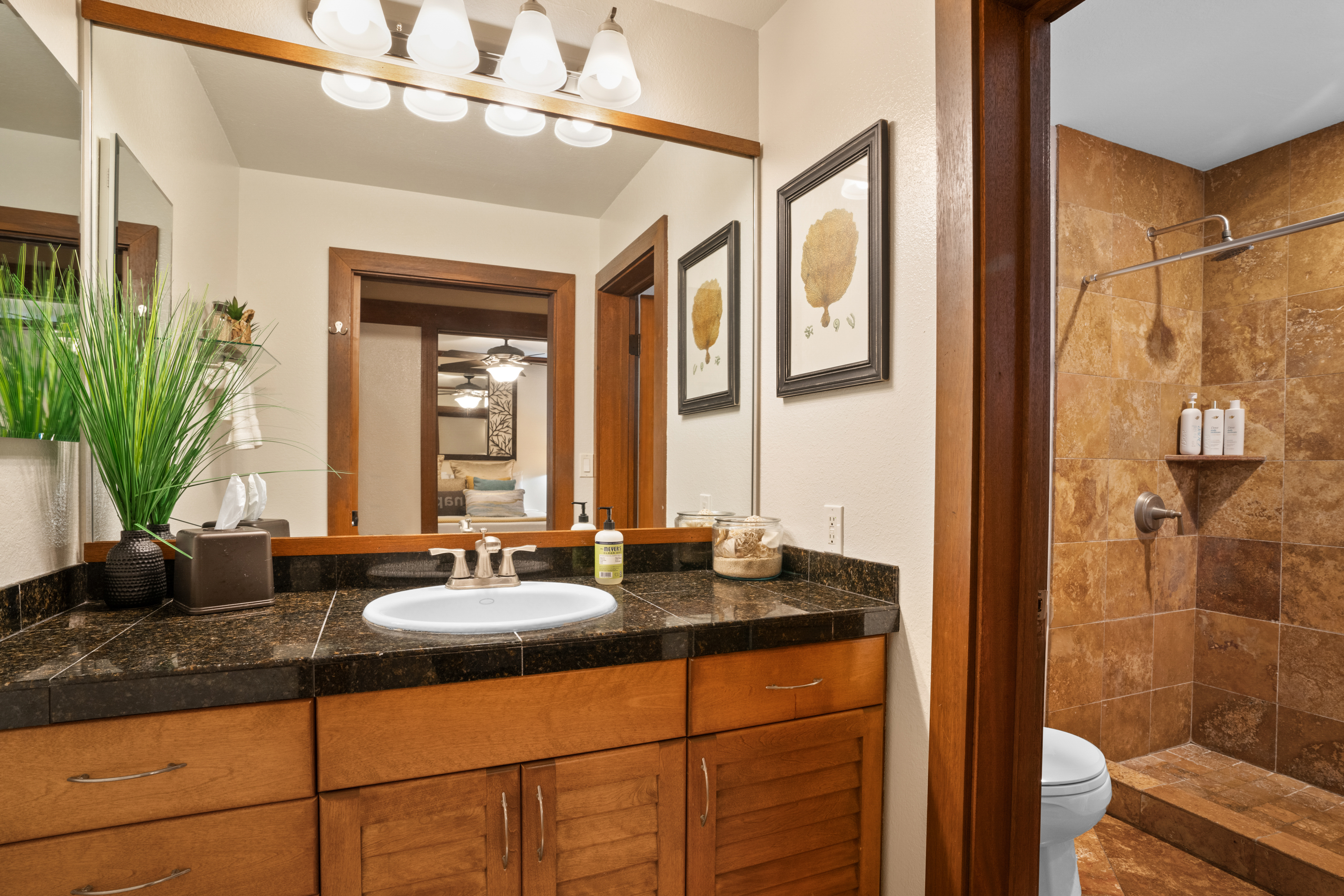 2253 Poipu Road, Unit 425 Koloa, HI 96756 - Photo 6 of 18 a bathroom with a sink a mirror and a shower
