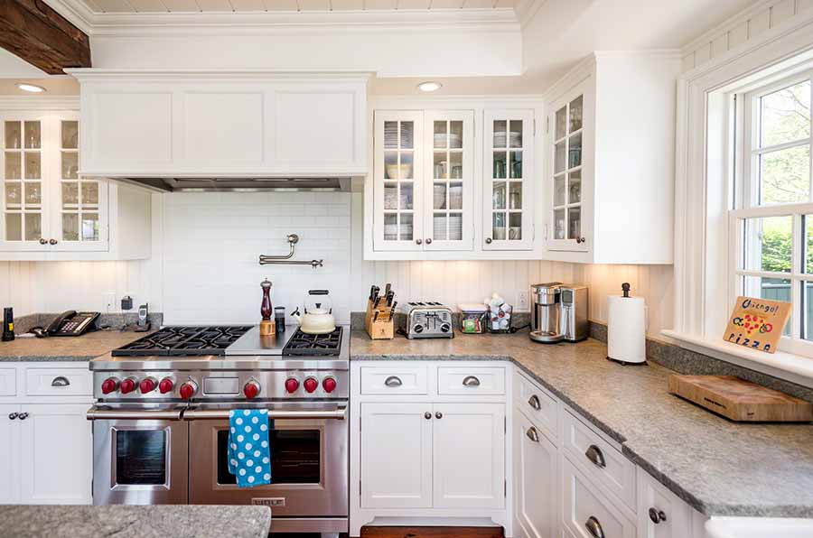 36 Down Harbor Road Edgartown, MA 02539 - Photo 16 of 54 a kitchen with stainless steel appliances a stove and cabinets
