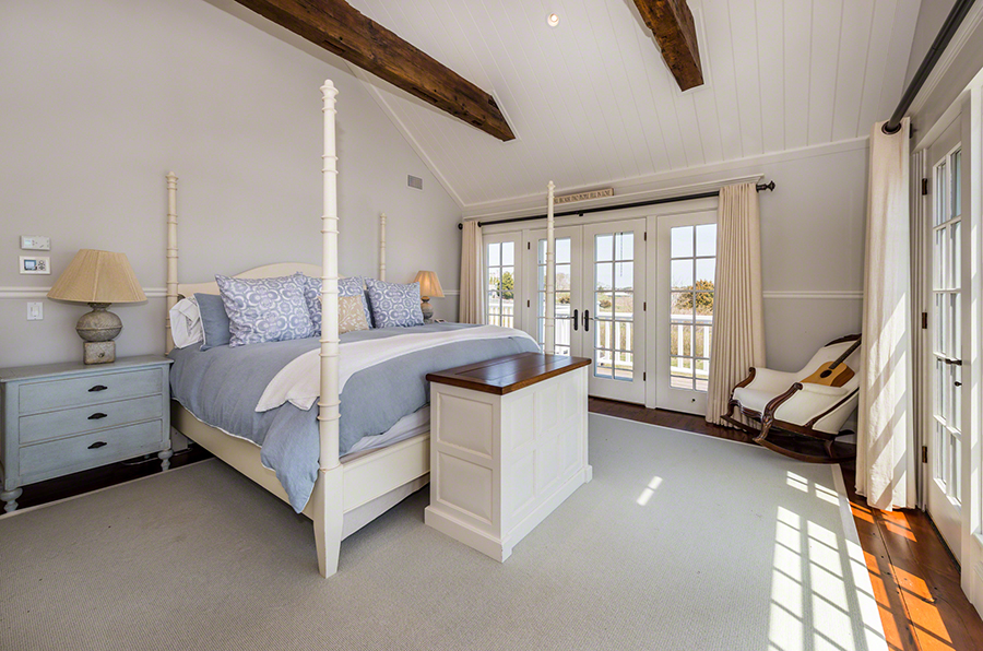 36 Down Harbor Road Edgartown, MA 02539 - Photo 28 of 54 a bedroom with a bed couch and a large window