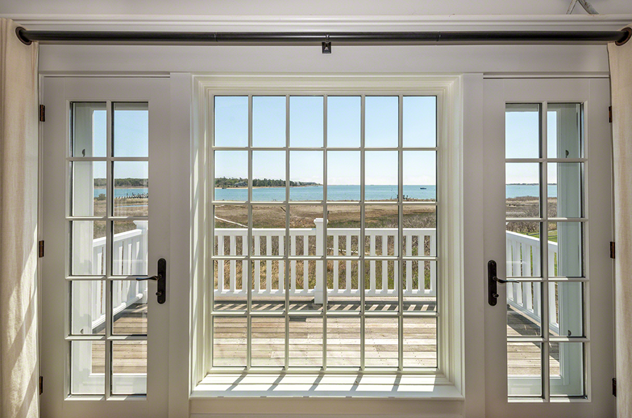 36 Down Harbor Road Edgartown, MA 02539 - Photo 35 of 54 a view of a porch with a floor to ceiling window