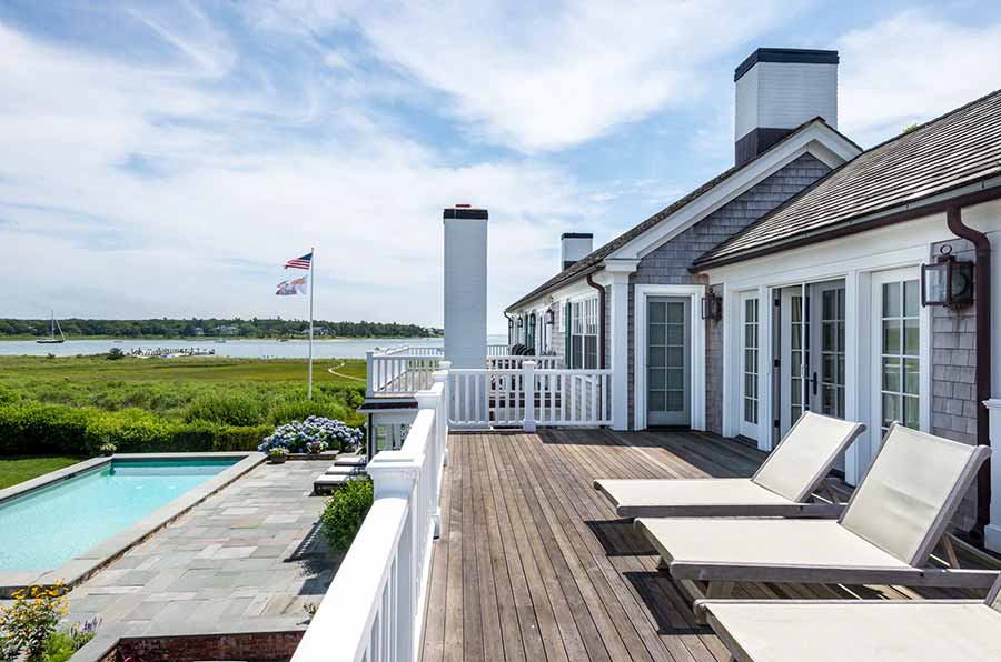 36 Down Harbor Road Edgartown, MA 02539 - Photo 38 of 54 a view of a house with backyard porch and wooden floor