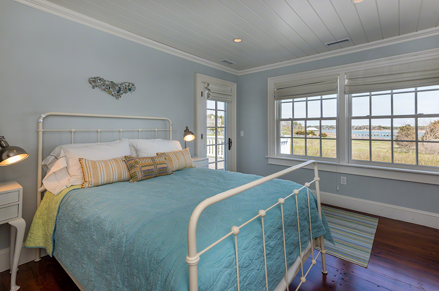 36 Down Harbor Road Edgartown, MA 02539 - Photo 40 of 54 a bedroom with a bed and a large window