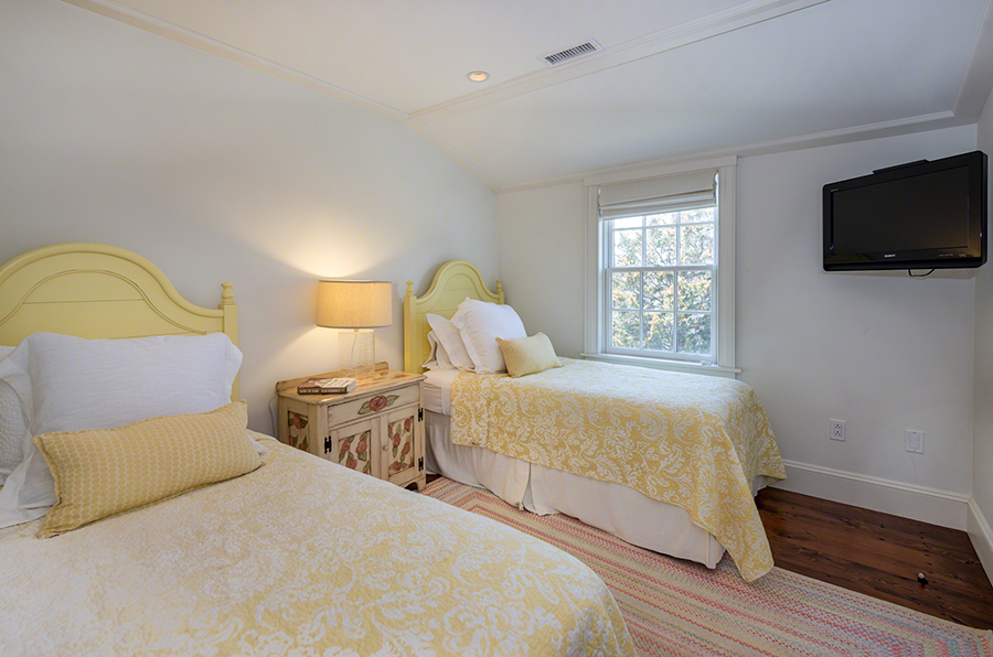 36 Down Harbor Road Edgartown, MA 02539 - Photo 43 of 54 a bedroom with a bed and a flat screen tv