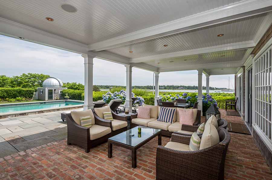 36 Down Harbor Road Edgartown, MA 02539 - Photo 49 of 54 a living room with patio furniture and a floor to ceiling window